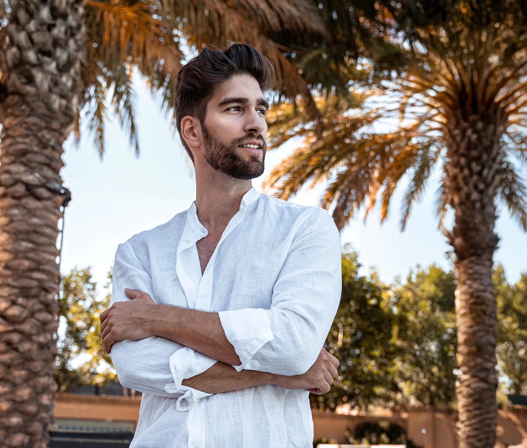 Portraits of fit men in coastal and tropical settings, showcasing the athletic, defined results of male body contouring and grooming.